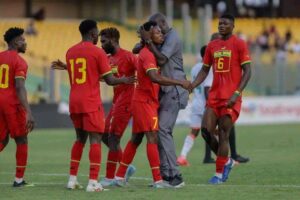 Black Stars coach, Otto Addo, gets onto the pitch to hug Jerry Afriyie after netting the equalizer against Niger.
